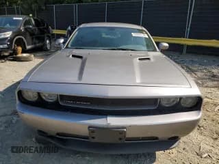 ✅ 2013 Dodge Challenger SXT • VIN: 2C3CDYAG0DH628853 • Lot: 69860134. Wystawiony na Copart z przebiegiem 169 157 mil. Bezpłatny archiwum sprzedaży aukcyjnych z USA i szczegółowy raport historii pojazdu na DreamBid. Zdjęcie 5.