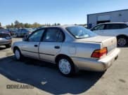 ✅ 1995 Toyota Corolla DX • VIN: 1NXAE09B8SZ301102 • Lot: 77038034. Wystawiony na Copart z przebiegiem 140 375 mil. Bezpłatny archiwum sprzedaży aukcyjnych z USA i szczegółowy raport historii pojazdu na DreamBid. Zdjęcie 2.