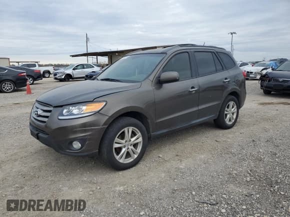 ✅ 2012 Hyundai Santa Fe Limited • VIN: 5XYZK4AG1CG156812 • Lot: 87953285. Listed on Copart with 186,428 mi. Free auction sales archive from the USA and detailed vehicle history report at DreamBid. Image 1.