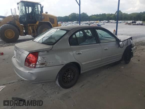 2004 Hyundai Elantra GLS with VIN KMHDN46D14U773672, listed as a Copart auction lot 69194635 with 189,128 mi miles and Salvage title. Bid and sale history available at DreamBid. Image 3.