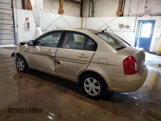 2007 Hyundai Accent GLS with VIN KMHCN46C87U103169, listed as a Copart auction lot 70390484 with 129,702 mi miles and Salvage title. Bid and sale history available at DreamBid. Image 2.
