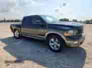 2009 Dodge 1500 Laramie with VIN 1D3HB13T19S752887, listed as a Copart auction lot 71537795 with 179,209 mi miles and Salvage title. Bid and sale history available at DreamBid. Image 4.