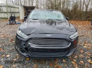 ✅ 2016 Ford Fusion S Hybrid • VIN: 3FA6P0UU1GR118805 • Lot: 93336205. Wystawiony na Copart z przebiegiem 141 238 mil. Bezpłatny archiwum sprzedaży aukcyjnych z USA i szczegółowy raport historii pojazdu na DreamBid. Zdjęcie 5.