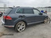 ✅ 2015 Volkswagen Touareg Sport • VIN: WVGEF9BPXFD002404 • Лот: 84428384. Опубликован ранее на Copart с пробегом Не указан. Бесплатный доступ к архиву аукционных продаж из США и подробный отчёт об истории автомобиля на DreamBid. Изображение 3.