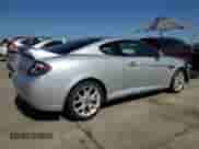 2008 Hyundai Tiburon GT z VIN KMHHN66F98U267849, wystawiony jako Copart lot #88506815 z przebiegiem 92 820 mil mil oraz Szkoda całkowita • Salvage title. Historia ofert i sprzedaży dostępna na DreamBid. Obrazek 3.