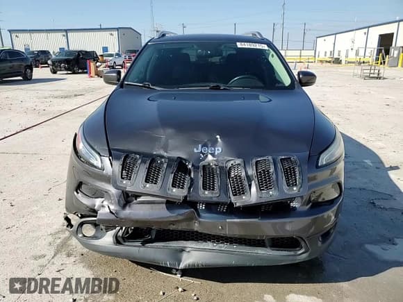 ✅ 2015 Jeep Cherokee Latitude • VIN: 1C4PJLCS5FW516841 • Lot: 84189215. Listed on Copart with 164,493 mi. Free auction sales archive from the USA and detailed vehicle history report at DreamBid. Image 14.