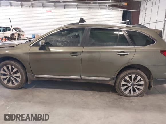 ✅ 2017 Subaru Outback Touring • VIN: 4S4BSETC7H3341519 • Lot: 42233227. Listed on IAAI with 128,384 mi. Free auction sales archive from the USA and detailed vehicle history report at DreamBid. Image 14.