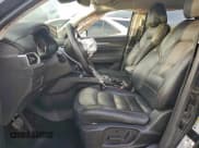 ✅ 2023 Mazda CX-5 S Carbon Edition • VIN: JM3KFBCM3P0189133 • Lot: 93620625. Listed on Copart with 56,552 mi. Free auction sales archive from the USA and detailed vehicle history report at DreamBid. Image 7.