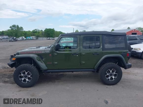 ✅ 2022 Jeep Wrangler Unlimited Rubicon • VIN: 1C4HJXFG5NW127263 • Lot: 42224299. Listed on IAAI with 52,553 mi. Free auction sales archive from the USA and detailed vehicle history report at DreamBid. Image 14.