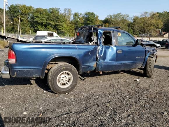 2000 Dodge Dakota Sport z VIN 1B7GG22N2YS659373, wystawiony jako Copart lot #75728094 z przebiegiem Nie podano mil oraz Szkoda całkowita • Salvage title. Historia ofert i sprzedaży dostępna na DreamBid. Obrazek 3.