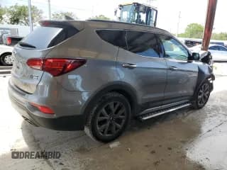 ✅ 2017 Hyundai Santa Fe Ultimate • VIN: 5XYZWDLA4HG489199 • Лот: 63521243. Опубликован ранее на Copart с пробегом 97 055 миль. Бесплатный доступ к архиву аукционных продаж из США и подробный отчёт об истории автомобиля на DreamBid. Изображение 3.