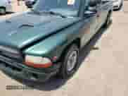 1999 Dodge Dakota SLT z VIN 1B7GL22X0XS145128, wystawiony jako Copart lot #64959364 z przebiegiem 96 047 mil mil oraz Szkoda całkowita • Salvage title. Historia ofert i sprzedaży dostępna na DreamBid. Obrazek 11.
