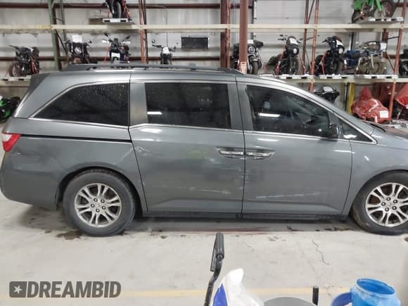 ✅ 2012 Honda Odyssey EX-L • VIN: 5FNRL5H64CB068778 • Lot: 42306089. Listed on IAAI with 337,868 mi. Free auction sales archive from the USA and detailed vehicle history report at DreamBid. Image 13.