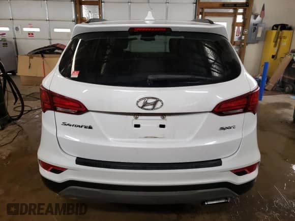 ✅ 2018 Hyundai Santa Fe 2.4L • VIN: 5NMZU3LB7JH101659 • Lot: 71634882. Wystawiony na Copart z przebiegiem 90 025 mil mil. Skorzystaj z bezpłatnego archiwum sprzedaży aukcyjnych z USA i zobacz szczegółowy raport historii pojazdu na DreamBid. Zdjęcie 6.