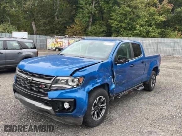 ✅ 2022 Chevrolet Colorado 4WD Z71 • VIN: 1GCGTDEN1N1200985 • Лот: 83494504. Опубликован ранее на Copart с пробегом 27 439 миль. Бесплатный доступ к архиву аукционных продаж из США и подробный отчёт об истории автомобиля на DreamBid. Изображение 2.