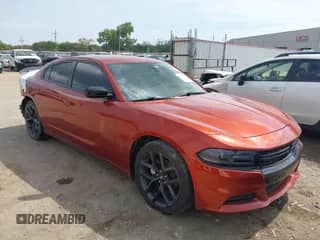 2021 Dodge Charger SXT with VIN 2C3CDXBG7MH612920, listed as a IAAI auction lot 43197794 with 77,359 mi miles and . Bid and sale history available at DreamBid. Image 1.