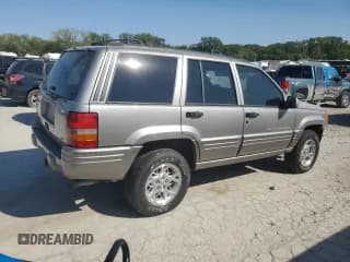 ✅ 1998 Jeep Grand Cherokee Limited • VIN: 1J4GZ78S5WC325148 • Лот: 67780424. Опубликован ранее на Copart с пробегом Не указан. Бесплатный доступ к архиву аукционных продаж из США и подробный отчёт об истории автомобиля на DreamBid. Изображение 3.