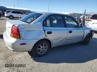 2003 Hyundai Accent GL с VIN KMHCG45C63U413388, выставлен на аукционе Copart как лот 88979235 с пробегом 240 928 миль миль и Списание • Salvage title. История ставок и продаж доступна на DreamBid. Изображение 3.