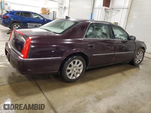 ✅ 2009 Cadillac DTS 1SC • VIN: 1G6KD57Y69U103129 • Lot: 63734235. Listed on Copart with 106,787 mi. Free auction sales archive from the USA and detailed vehicle history report at DreamBid. Image 3.