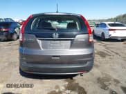 ✅ 2013 Honda CR-V LX • VIN: 3CZRM3H39DG710070 • Lot: 43602535. Listed on IAAI with 105,591 mi. Free auction sales archive from the USA and detailed vehicle history report at DreamBid. Image 16.