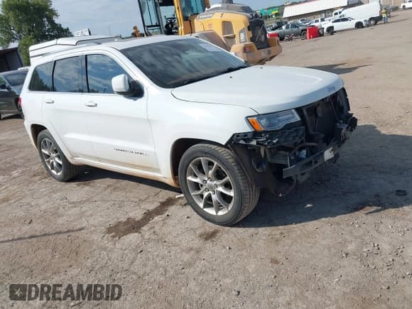 ✅ 2015 Jeep Grand Cherokee Summit • VIN: 1C4RJEJG5FC105296 • Lot: 43231201. Listed on IAAI with 124,311 mi. Free auction sales archive from the USA and detailed vehicle history report at DreamBid. Image 1.