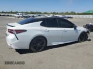 ✅ 2021 Toyota Camry Hybrid XSE • VIN: 4T1K31AK0MU028493 • Lot: 68765375. Listed on Copart with 125,781 mi. Free auction sales archive from the USA and detailed vehicle history report at DreamBid. Image 3.