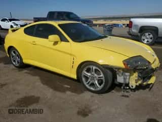 2005 Hyundai Tiburon GT с VIN KMHHN65F75U170498, выставлен на аукционе Copart как лот 58391985 с пробегом 190 374 миль миль и Списание • Salvage title. История ставок и продаж доступна на DreamBid. Изображение 4.