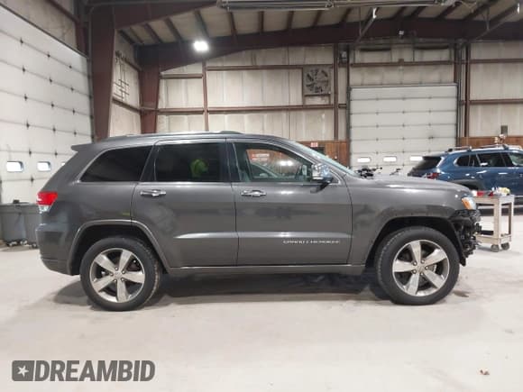 ✅ 2014 Jeep Grand Cherokee Overland • VIN: 1C4RJFCGXEC340052 • Lot: 43485667. Listed on IAAI with 113,840 mi. Free auction sales archive from the USA and detailed vehicle history report at DreamBid. Image 13.