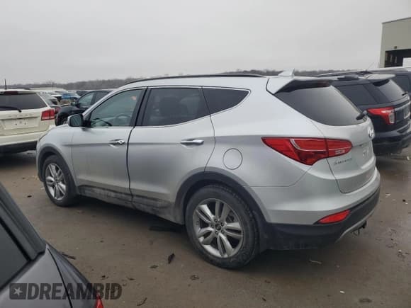 ✅ 2015 Hyundai Santa Fe • VIN: 5XYZWDLAXFG262726 • Лот: 40037664. Опубликован ранее на Copart с пробегом 100 572 миль. Бесплатный доступ к архиву аукционных продаж из США и подробный отчёт об истории автомобиля на DreamBid. Изображение 2.