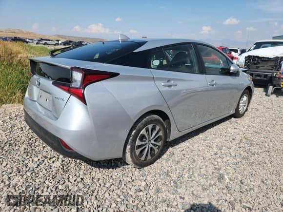 2021 Toyota Prius L Eco with VIN JTDKAMFU1M3150517, listed as a Copart auction lot 70697765 with 107,800 mi miles and Salvage title. Bid and sale history available at DreamBid. Image 3.
