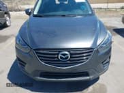 ✅ 2016 Mazda CX-5 Grand Touring • VIN: JM3KE4DY3G0912088 • Lot: 42203530. Wystawiony na IAAI z przebiegiem 86 914 mil. Bezpłatny archiwum sprzedaży aukcyjnych z USA i szczegółowy raport historii pojazdu na DreamBid. Zdjęcie 12.