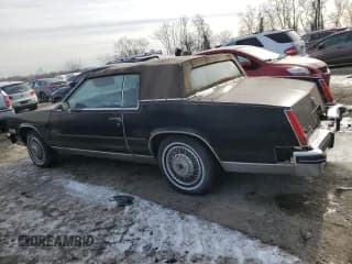 ✅ 1984 Cadillac Eldorado • VIN: 1G6AL5784EE626474 • Лот: 89302645. Опубликован ранее на Copart с пробегом 23 856 миль. Бесплатный доступ к архиву аукционных продаж из США и подробный отчёт об истории автомобиля на DreamBid. Изображение 2.