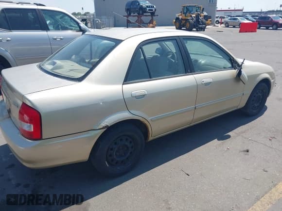 ✅ 2002 Mazda Protege DX • VIN: JM1BJ225521591241 • Лот: 42768329. Опубликован ранее на IAAI с пробегом 193 642 миль. Бесплатный доступ к архиву аукционных продаж из США и подробный отчёт об истории автомобиля на DreamBid. Изображение 4.