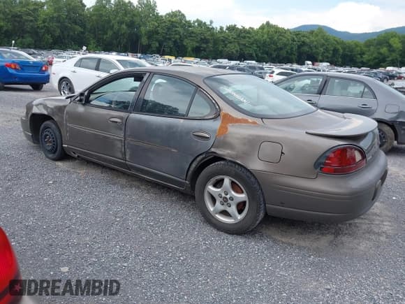 ✅ 2001 Pontiac Grand Prix SE • VIN: 1G2WK52J21F162657 • Лот: 42634127. Опубликован ранее на IAAI с пробегом 201 423 миль. Бесплатный доступ к архиву аукционных продаж из США и подробный отчёт об истории автомобиля на DreamBid. Изображение 3.