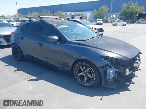 ✅ 2014 Mazda 3 i Sport • VIN: JM1BM1K75E1204517 • Lot: 42569990. Listed on IAAI with 98,502 mi. Free auction sales archive from the USA and detailed vehicle history report at DreamBid. Image 1.