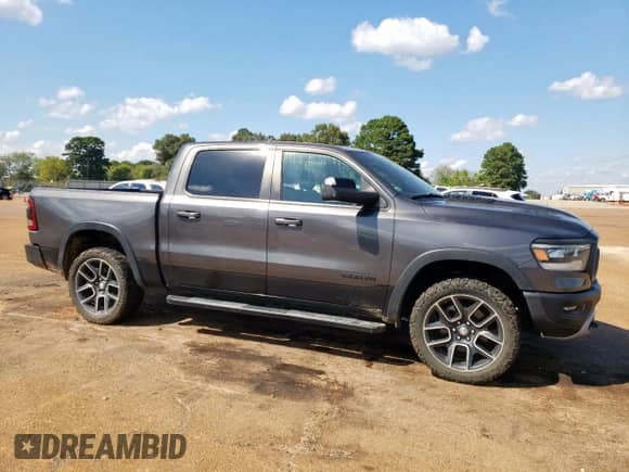 2020 Ram 1500 Rebel с VIN 1C6RRELT0LN303469, выставлен на аукционе Copart как лот 81731325 с пробегом 131 007 миль миль и Списание • Salvage title. История ставок и продаж доступна на DreamBid. Изображение 4.