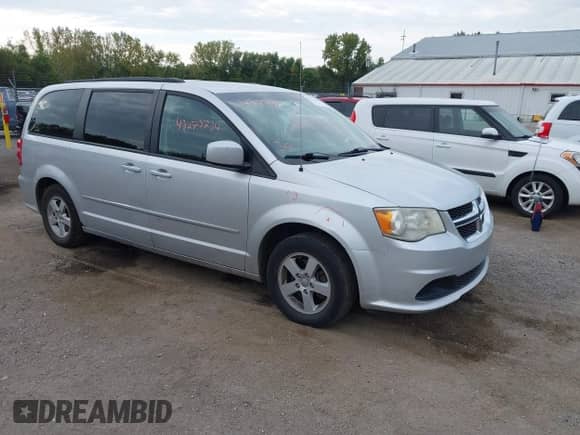 2012 Dodge Grand Caravan SXT z VIN 2C4RDGCG1CR197431, wystawiony jako IAAI lot #43273747 z przebiegiem 243 376 mil mil oraz . Historia ofert i sprzedaży dostępna na DreamBid. Obrazek 1.