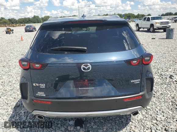 ✅ 2023 Mazda CX-50 Premium Plus • VIN: 7MMVABEY5PN117955 • Лот: 81015135. Опубликован ранее на Copart с пробегом 41 941 миль. Бесплатный доступ к архиву аукционных продаж из США и подробный отчёт об истории автомобиля на DreamBid. Изображение 6.