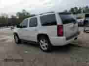 2007 Chevrolet Tahoe LTZ with VIN 1GNFC13007R183609, listed as a Copart auction lot 81827535 with 233,431 mi miles and Salvage title. Bid and sale history available at DreamBid. Image 2.