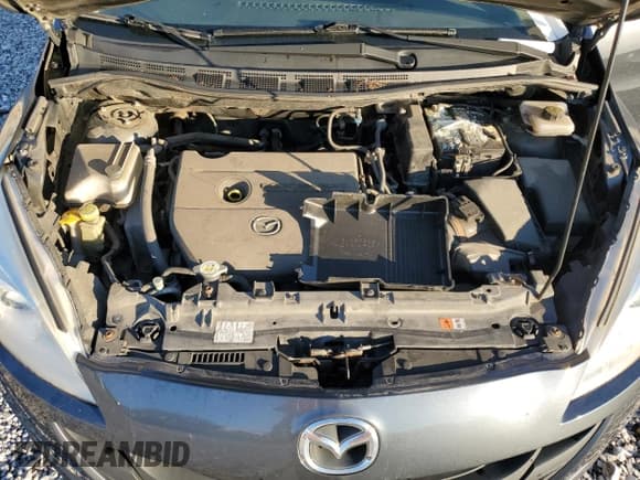 ✅ 2012 Mazda 5 Sport • VIN: JM1CW2BL4C0100945 • Lot: 86185665. Listed on Copart with 132,165 mi. Free auction sales archive from the USA and detailed vehicle history report at DreamBid. Image 12.