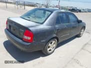 ✅ 2002 Mazda Protege DX • VIN: JM1BJ225420500238 • Lot: 42713843. Listed on IAAI with 171,286 mi. Free auction sales archive from the USA and detailed vehicle history report at DreamBid. Image 4.