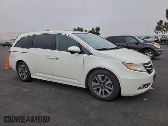 ✅ 2015 Honda Odyssey Touring Elite • VIN: 5FNRL5H94FB104726 • Lot: 96195135. Listed on Copart with 51,594 mi. Free auction sales archive from the USA and detailed vehicle history report at DreamBid. Image 4.