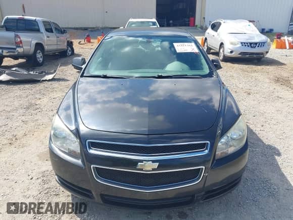 2012 Chevrolet Malibu 1LS z VIN 1G1ZB5E02CF301242, wystawiony jako IAAI lot #43411361 z przebiegiem 158 844 mil mil oraz . Historia ofert i sprzedaży dostępna na DreamBid. Obrazek 13.