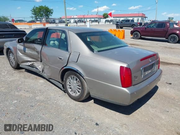 ✅ 2004 Cadillac DeVille DHS • VIN: 1G6KE54Y04U130501 • Lot: 42318769. Listed on IAAI with 81,512 mi. Free auction sales archive from the USA and detailed vehicle history report at DreamBid. Image 3.
