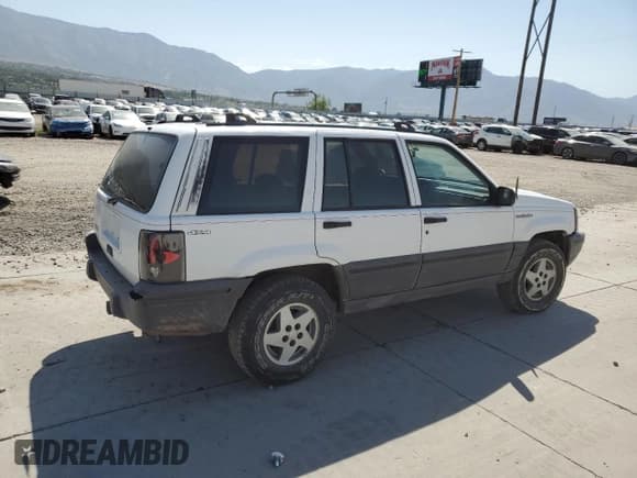 ✅ 1994 Jeep Grand Cherokee Laredo • VIN: 1J4GZ58S6RC310800 • Лот: 64095725. Опубликован ранее на Copart с пробегом 241 876 миль. Бесплатный доступ к архиву аукционных продаж из США и подробный отчёт об истории автомобиля на DreamBid. Изображение 3.