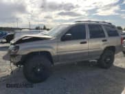 ✅ 1999 Jeep Grand Cherokee Laredo • VIN: 1J4GW58N0XC692998 • Lot: 86833535. Wystawiony na Copart z przebiegiem 130 532 mil. Bezpłatny archiwum sprzedaży aukcyjnych z USA i szczegółowy raport historii pojazdu na DreamBid. Zdjęcie 1.