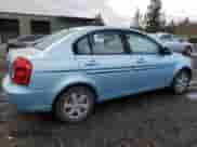 2006 Hyundai Accent GLS with VIN KMHCN46C56U004971, listed as a Copart auction lot 77301034 with 229,170 mi miles and Salvage title. Bid and sale history available at DreamBid. Image 3.