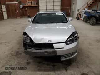 2007 Hyundai Tiburon GT z VIN KMHHN66F47U251850, wystawiony jako Copart lot #51900565 z przebiegiem 130 388 mil mil oraz Szkoda całkowita • Salvage title. Historia ofert i sprzedaży dostępna na DreamBid. Obrazek 5.