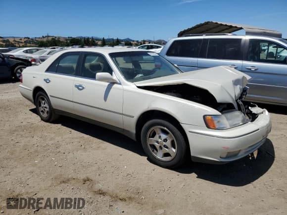 ✅ 1997 Infiniti Q45 • VIN: JNKBY31D2VM000164 • Lot: 58198265. Listed on Copart with 223,683 mi. Free auction sales archive from the USA and detailed vehicle history report at DreamBid. Image 4.