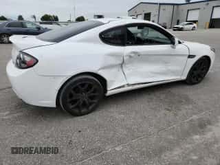 2007 Hyundai Tiburon GT с VIN KMHHN66F47U249354, выставлен на аукционе Copart как лот 69979965 с пробегом 168 813 миль миль и Списание • Salvage title. История ставок и продаж доступна на DreamBid. Изображение 3.